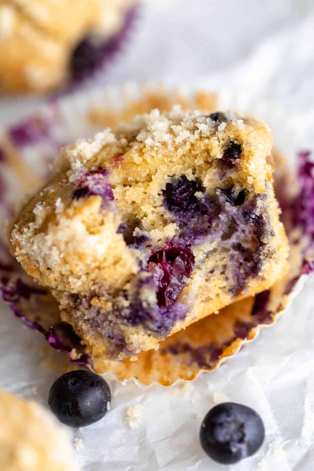 one bite taken out of the muffin to show texture