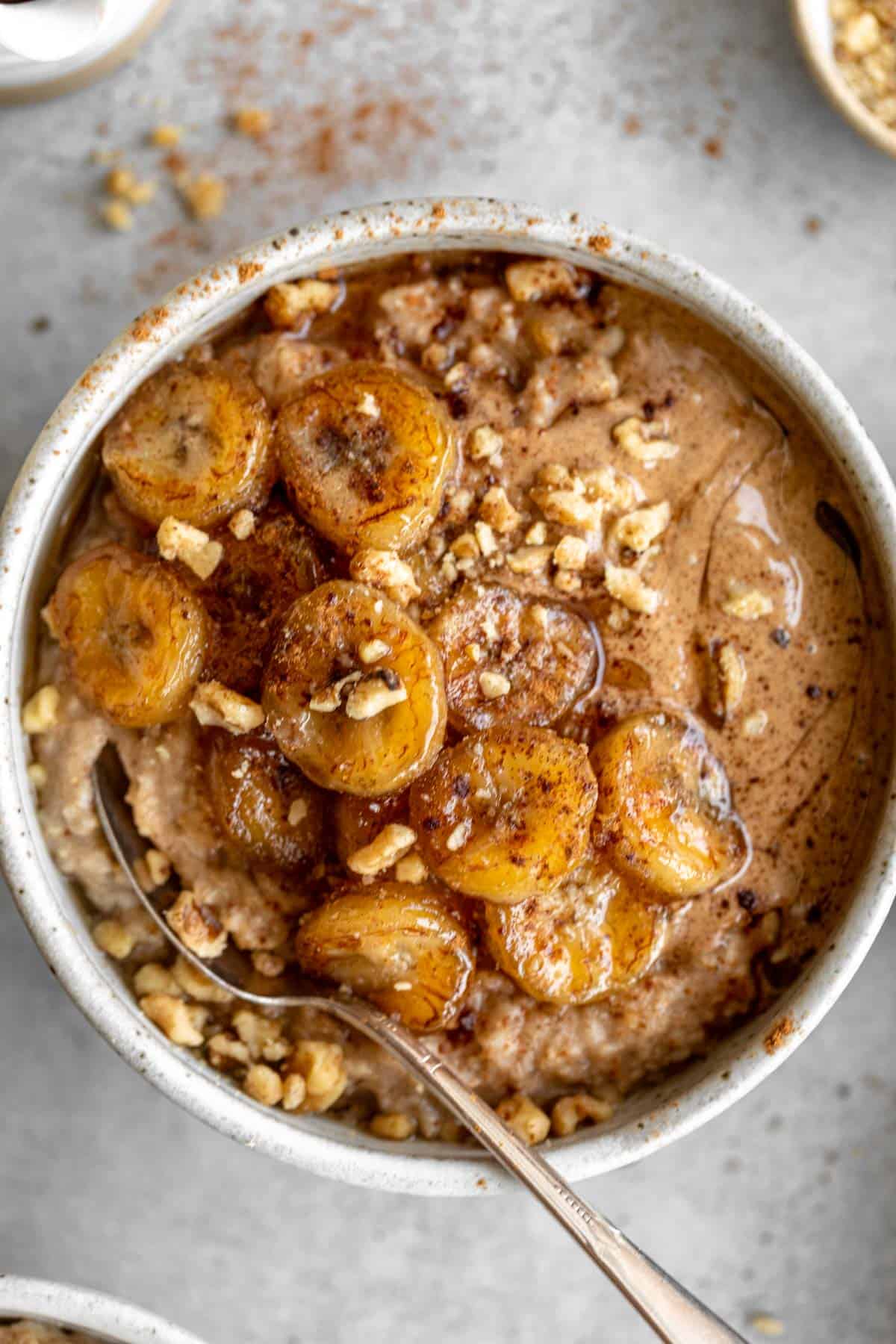 spoon in a bowl of oatmeal with banana