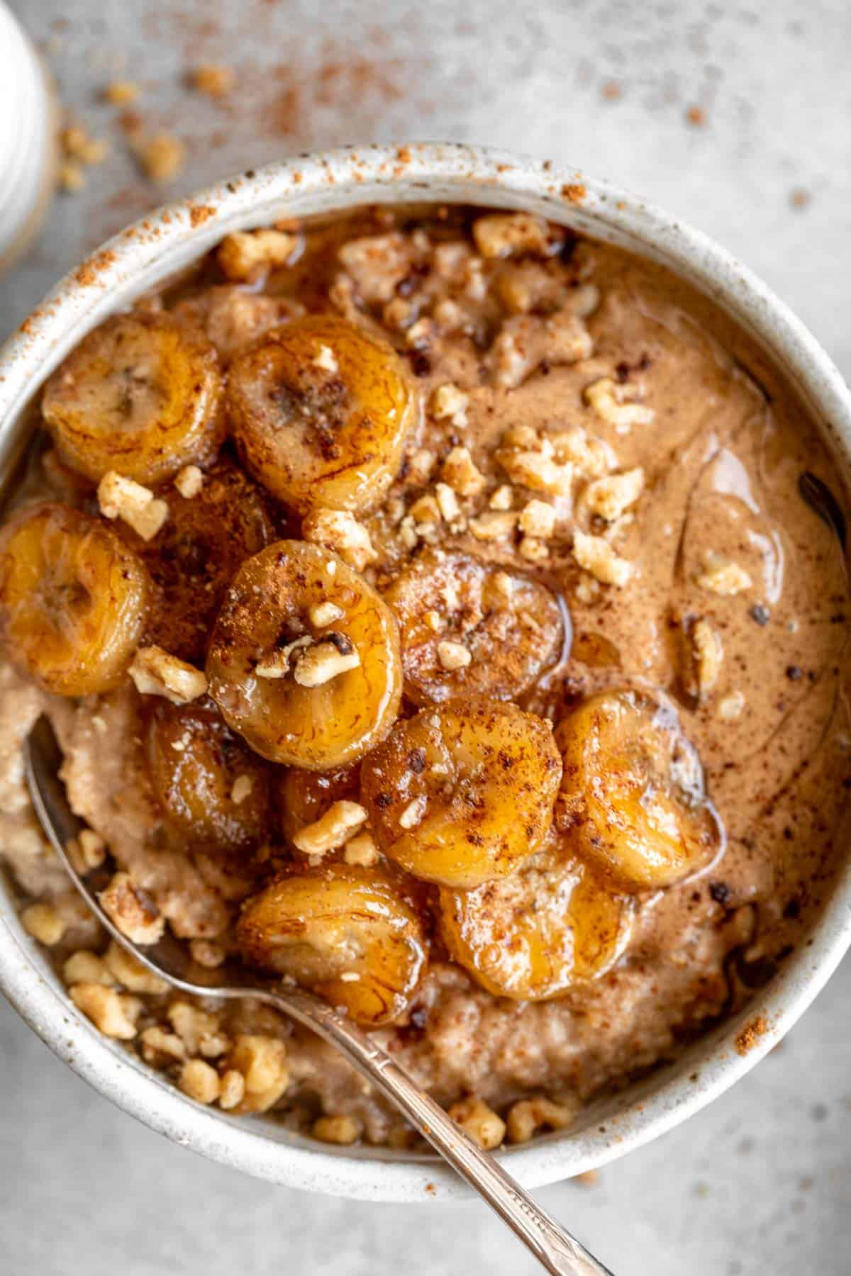 caramelized banana oatmeal in a bowl with almond butter