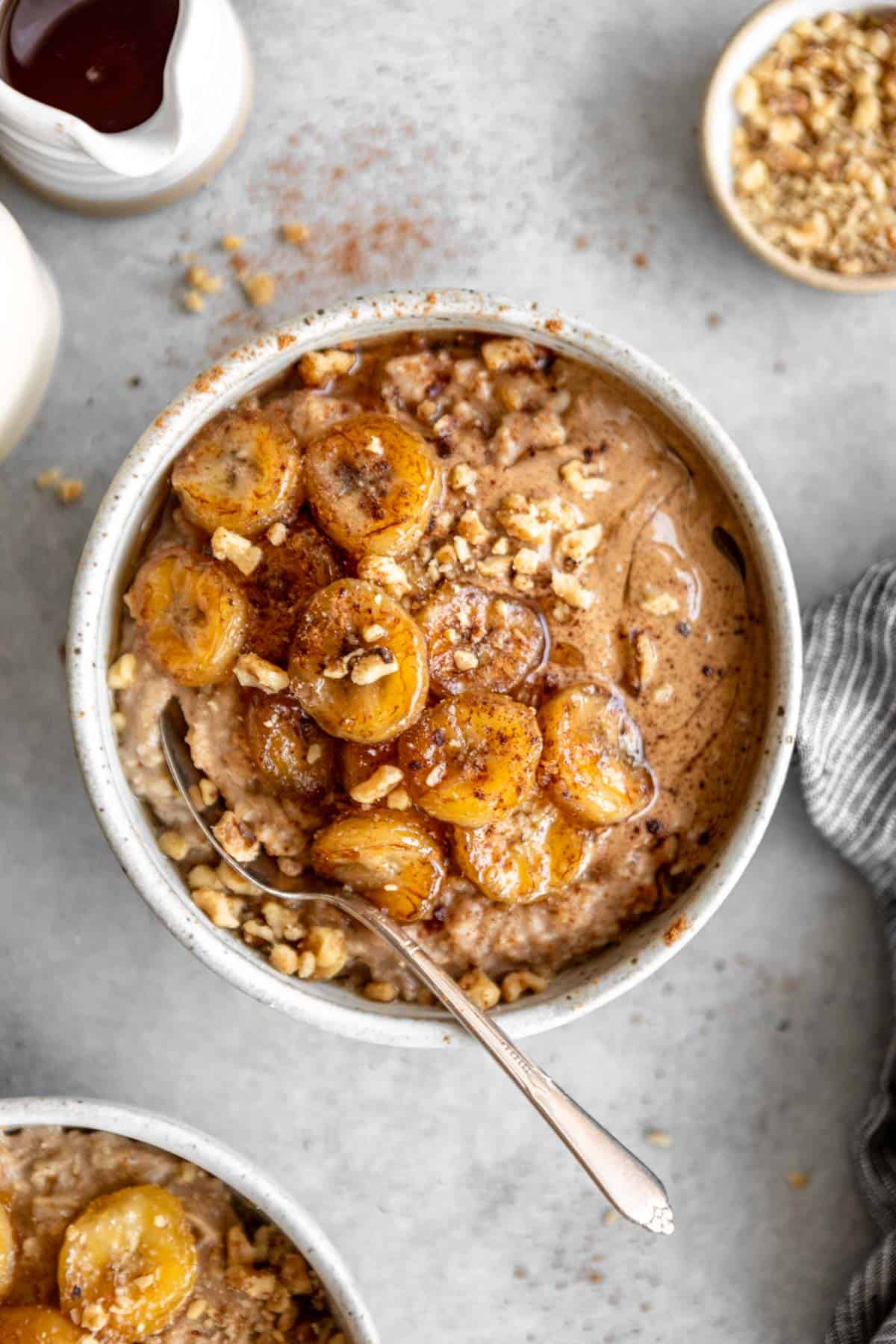caramelized banana oatmeal in a bowl with chopped nuts