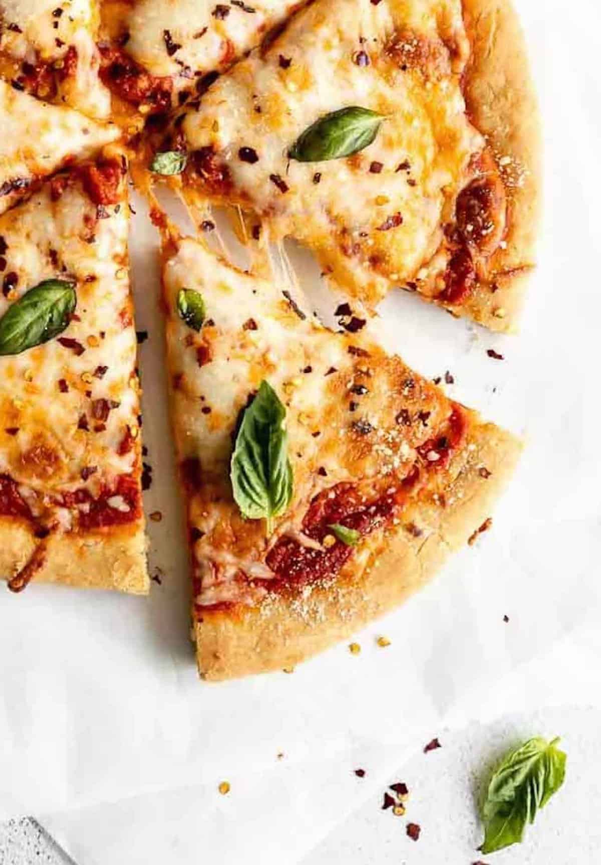 gluten free pizza dough with melted cheese