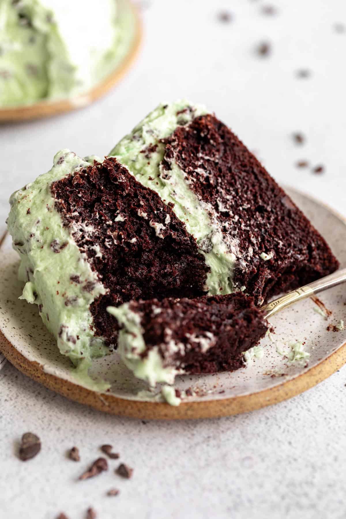 two slices of the mint chocolate cake with a bite taken out