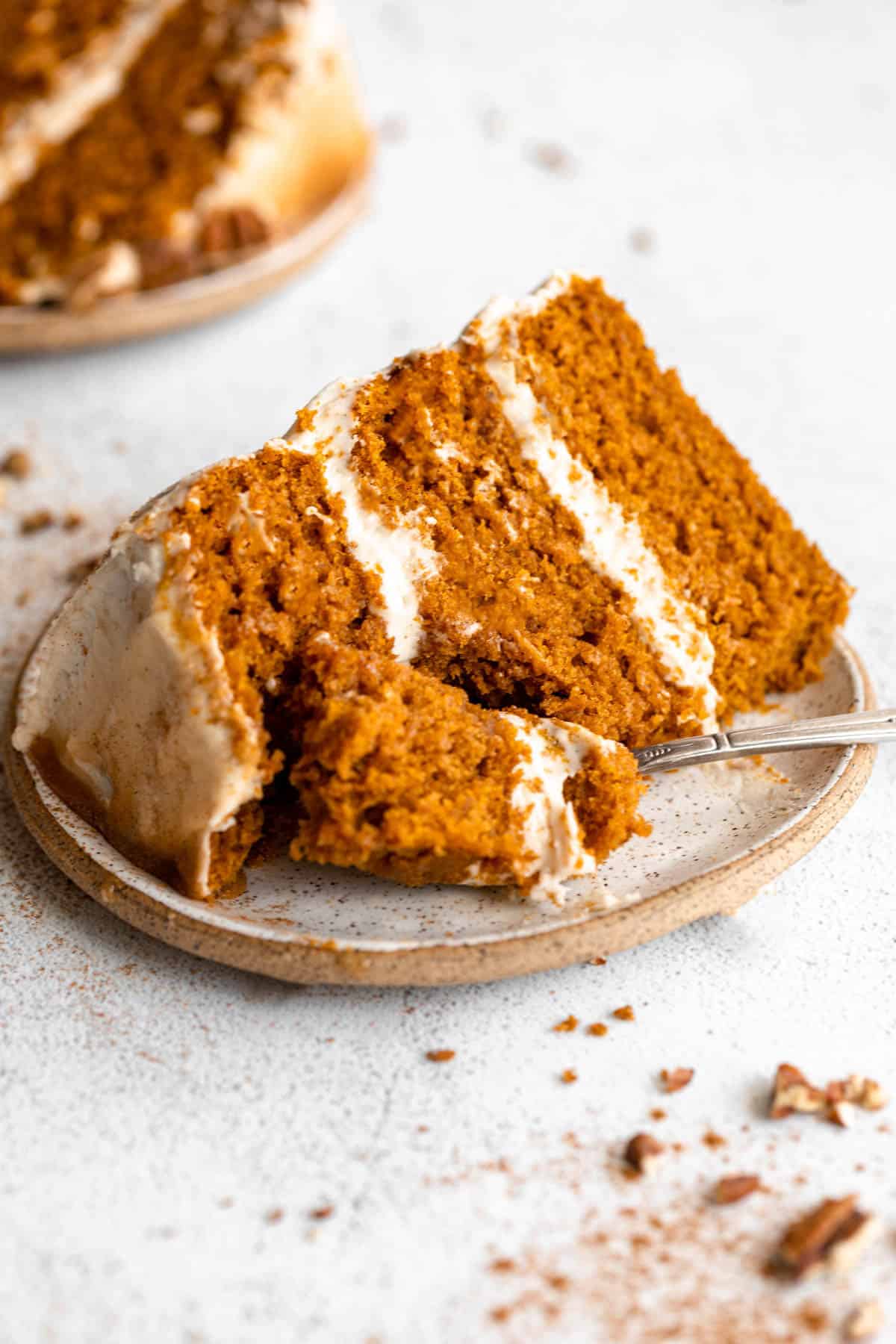 gluten free pumpkin cake on a plate with a bite taken out