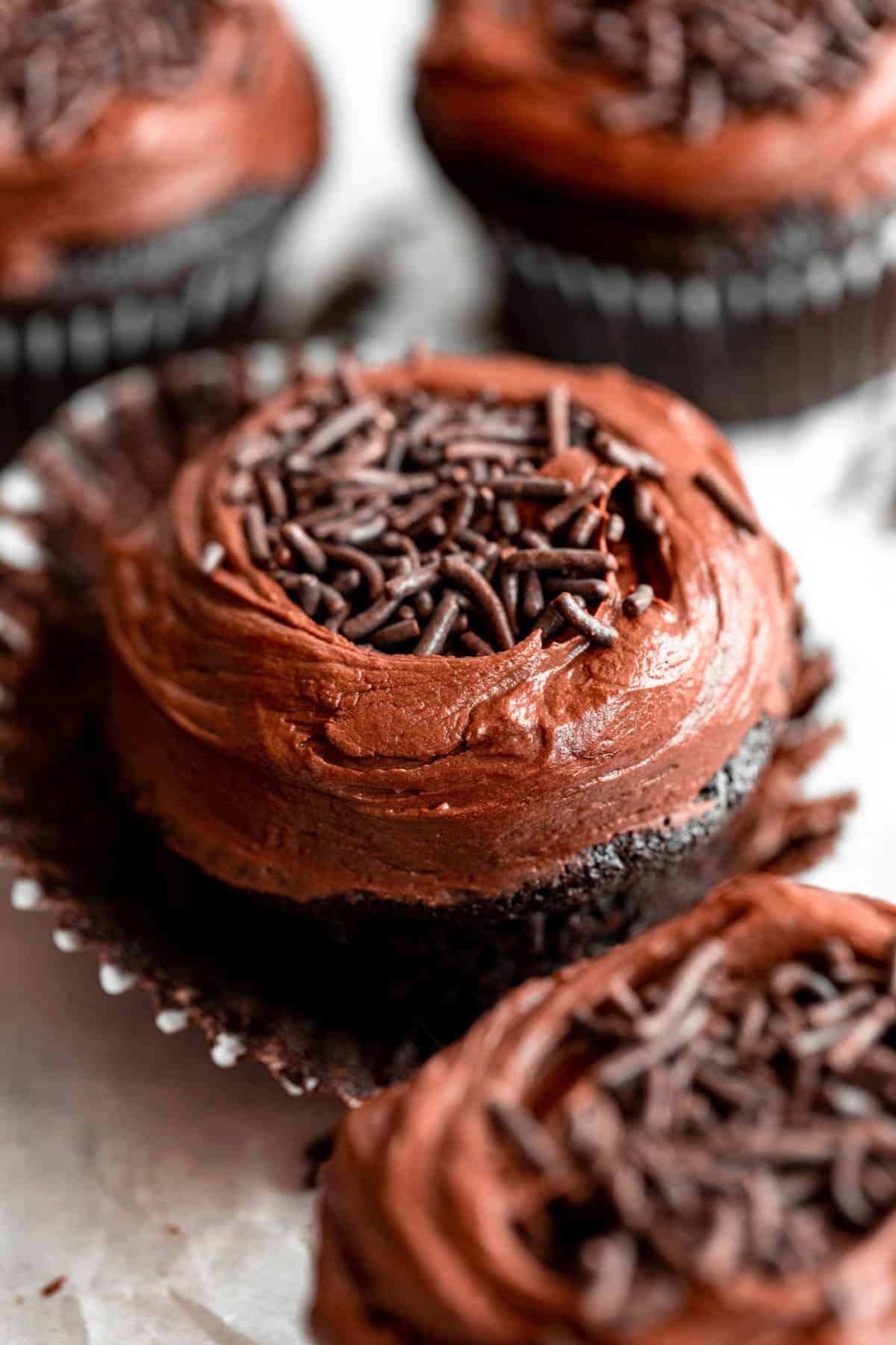 vegan buttercream on top of the chocolate cupcakes
