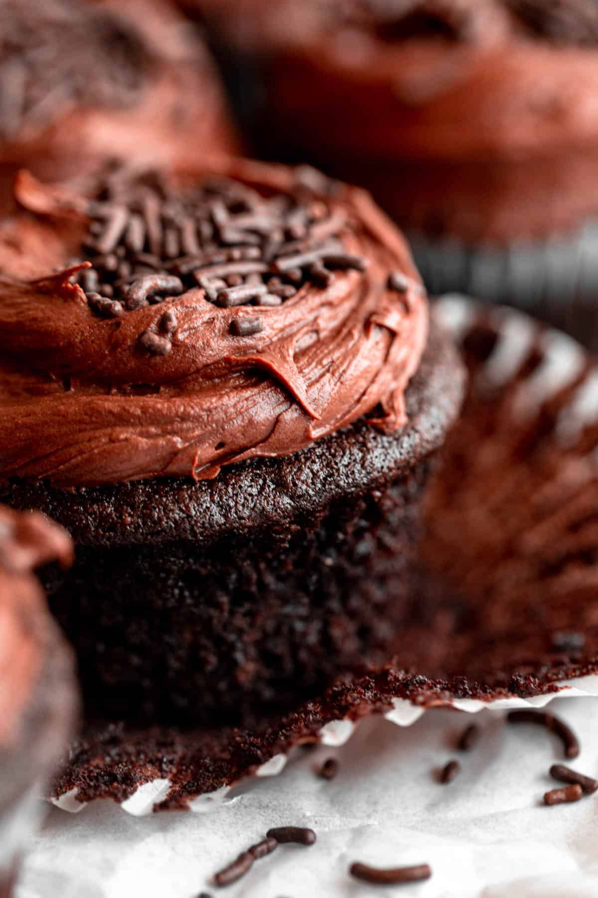 vegan chocolate cupcakes with buttercream on top