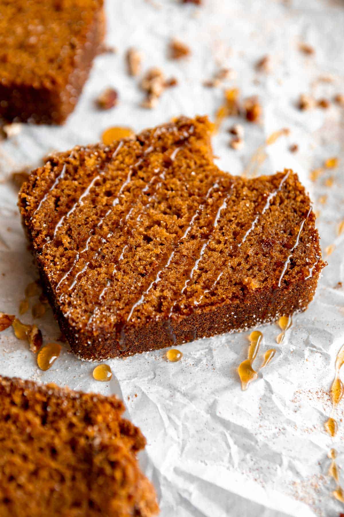 slice of gluten free pumpkin bread with honey drizzled on top