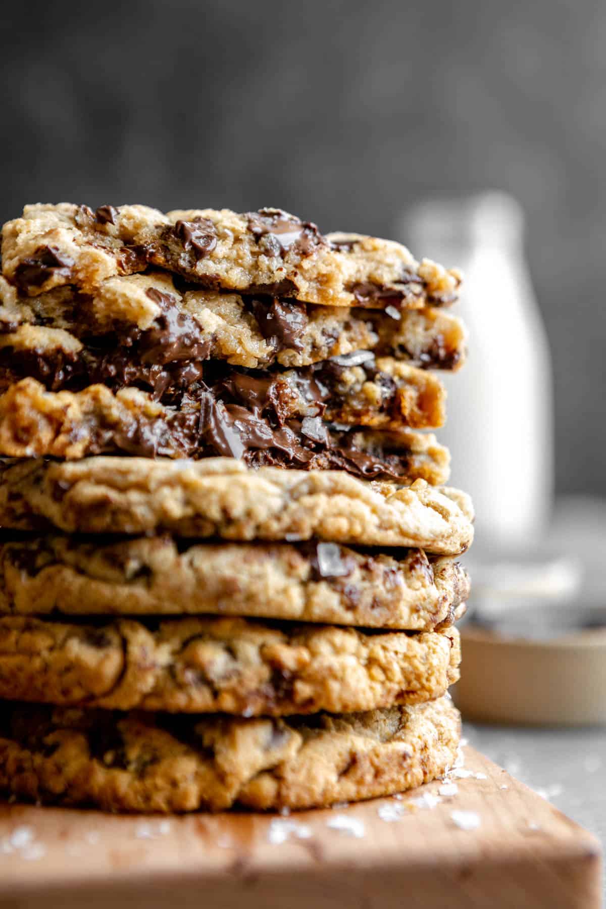 stack of the vegan chocolate chip cookies ripped in half to show gooey texture