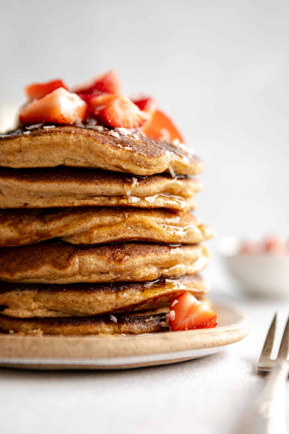 coconut flour pancakes with strawberries on top