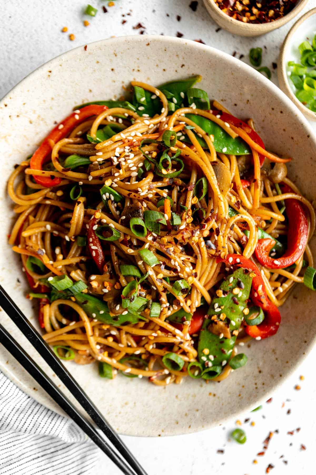 vegan vegetable lo mein with scallions on top 