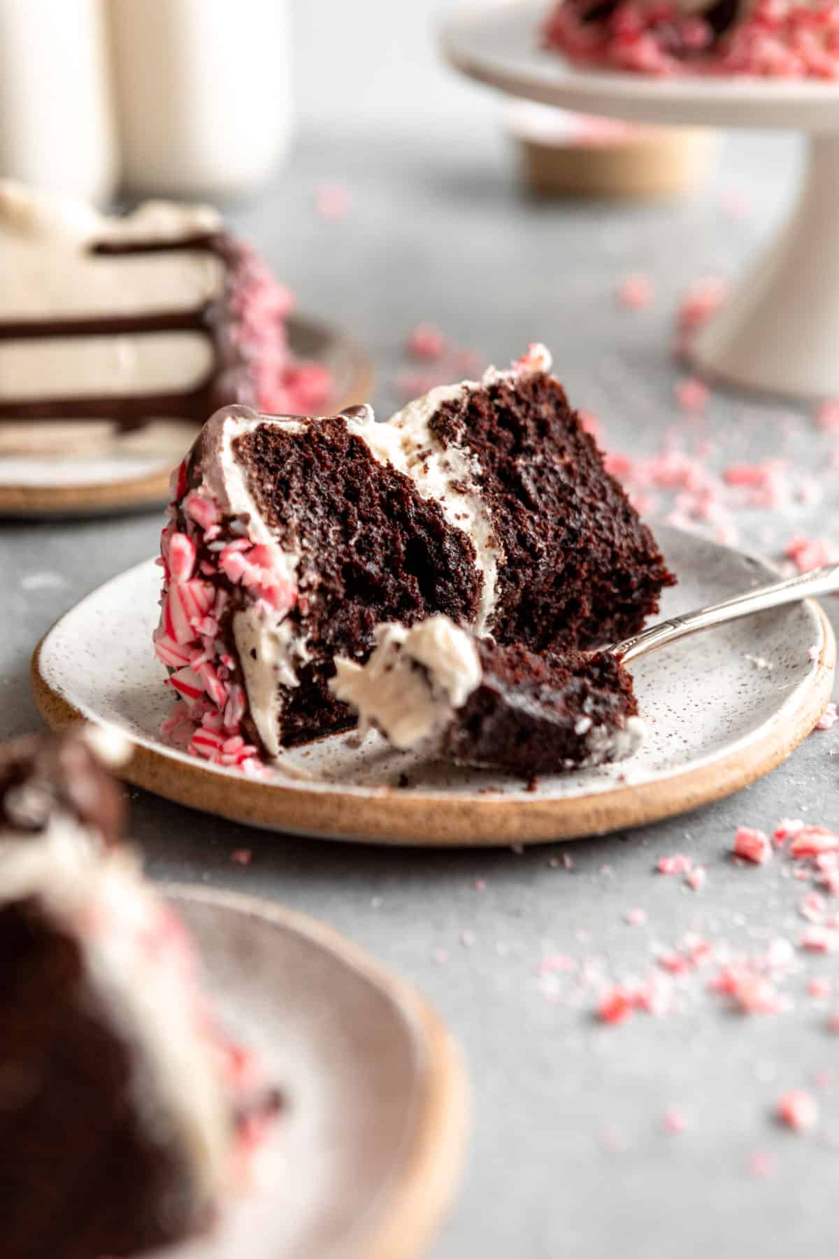 chocolate peppermint cake on three plates with a fork