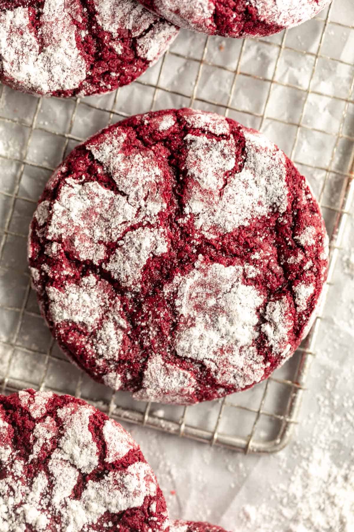gluten free red velvet crinkle cookie with powdered sugar on top