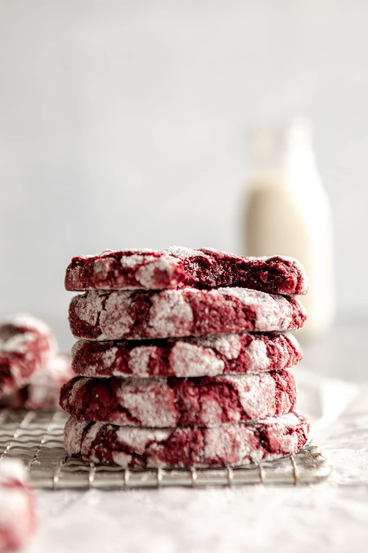 stack of the gluten free red velvet crinkle cookie on parchment paper