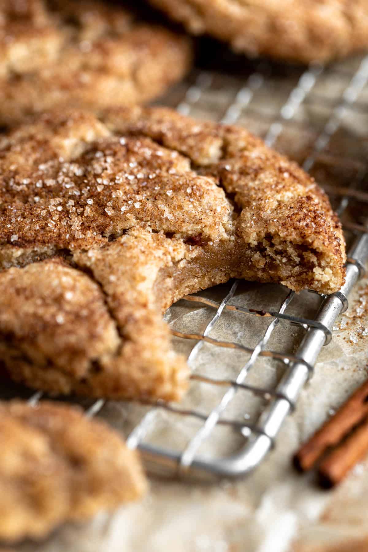 bite taken out of the vegan snickerdodles with cinnamon sugar