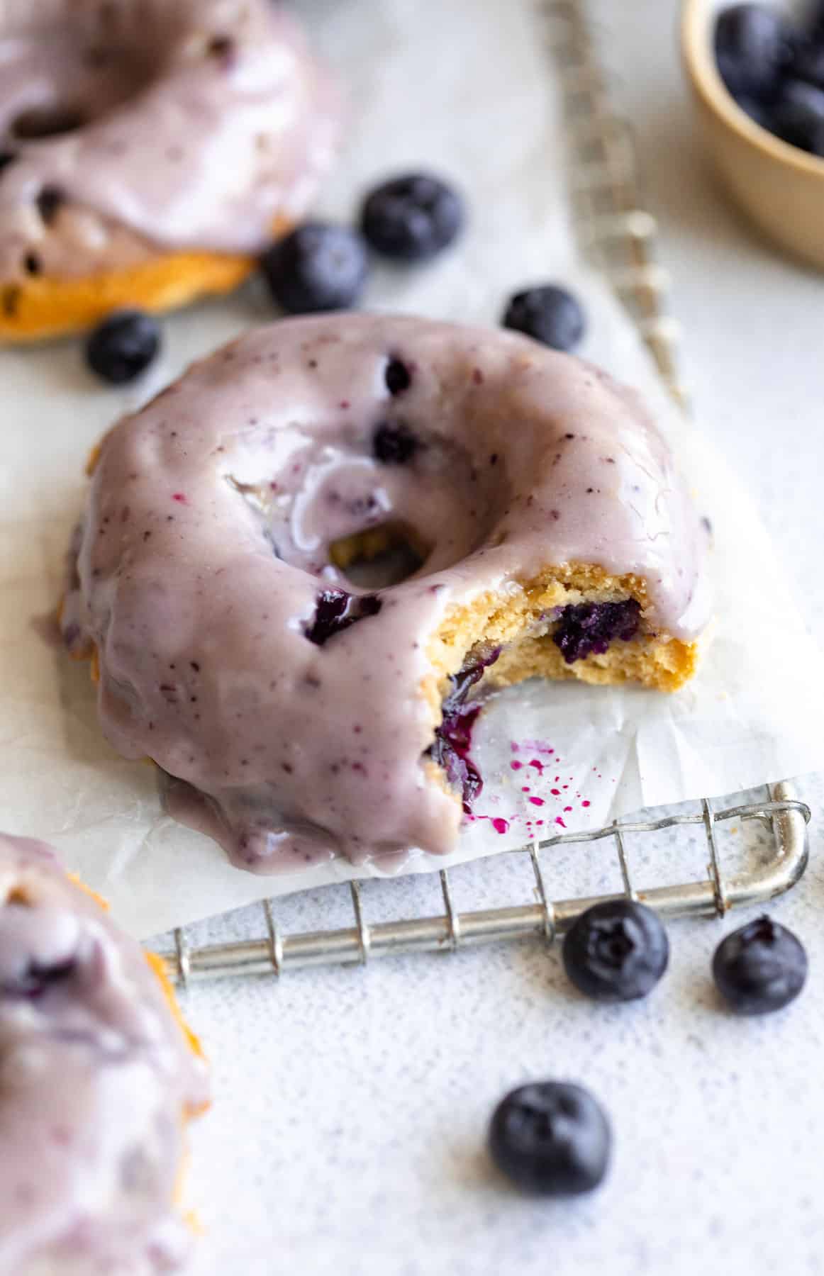 blueberry protein donuts with a bite taken out