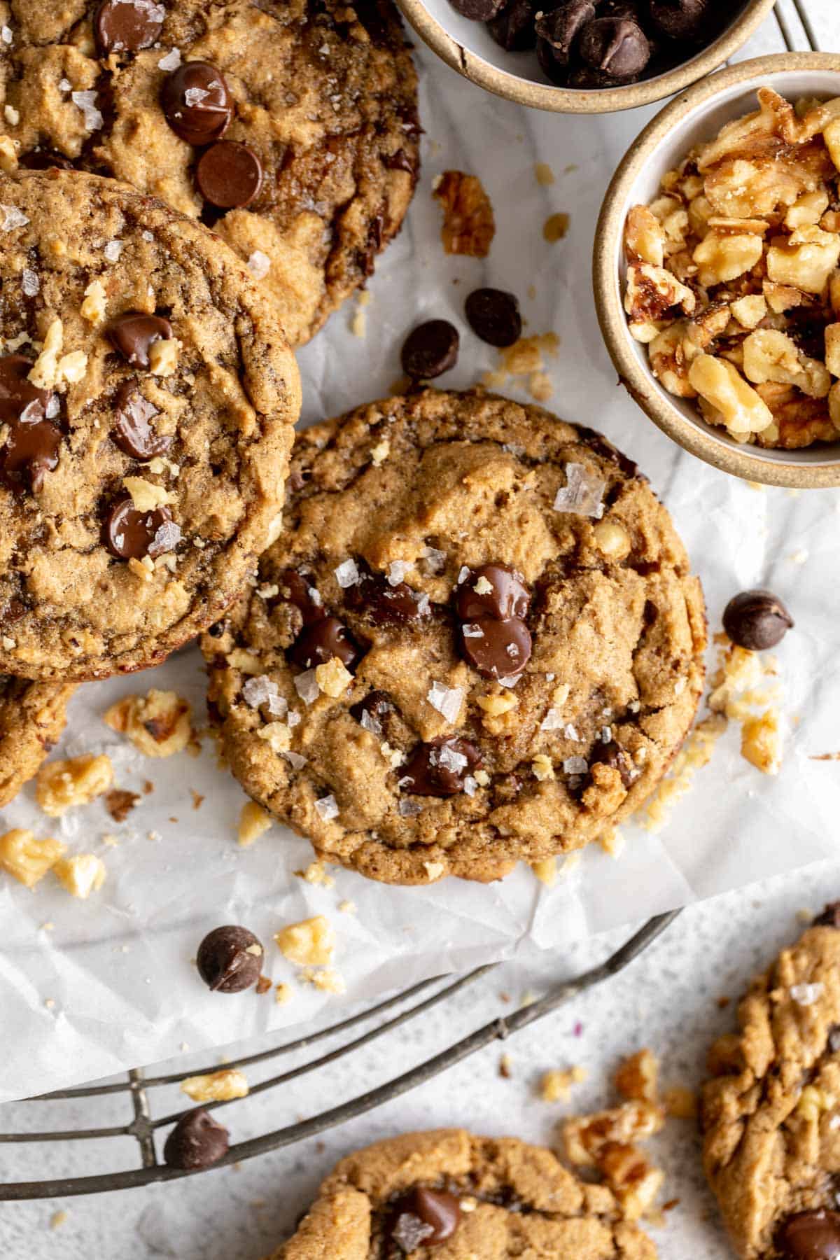 gluten free banana bread cookies with chocolate chips and walnuts on parchment paper
