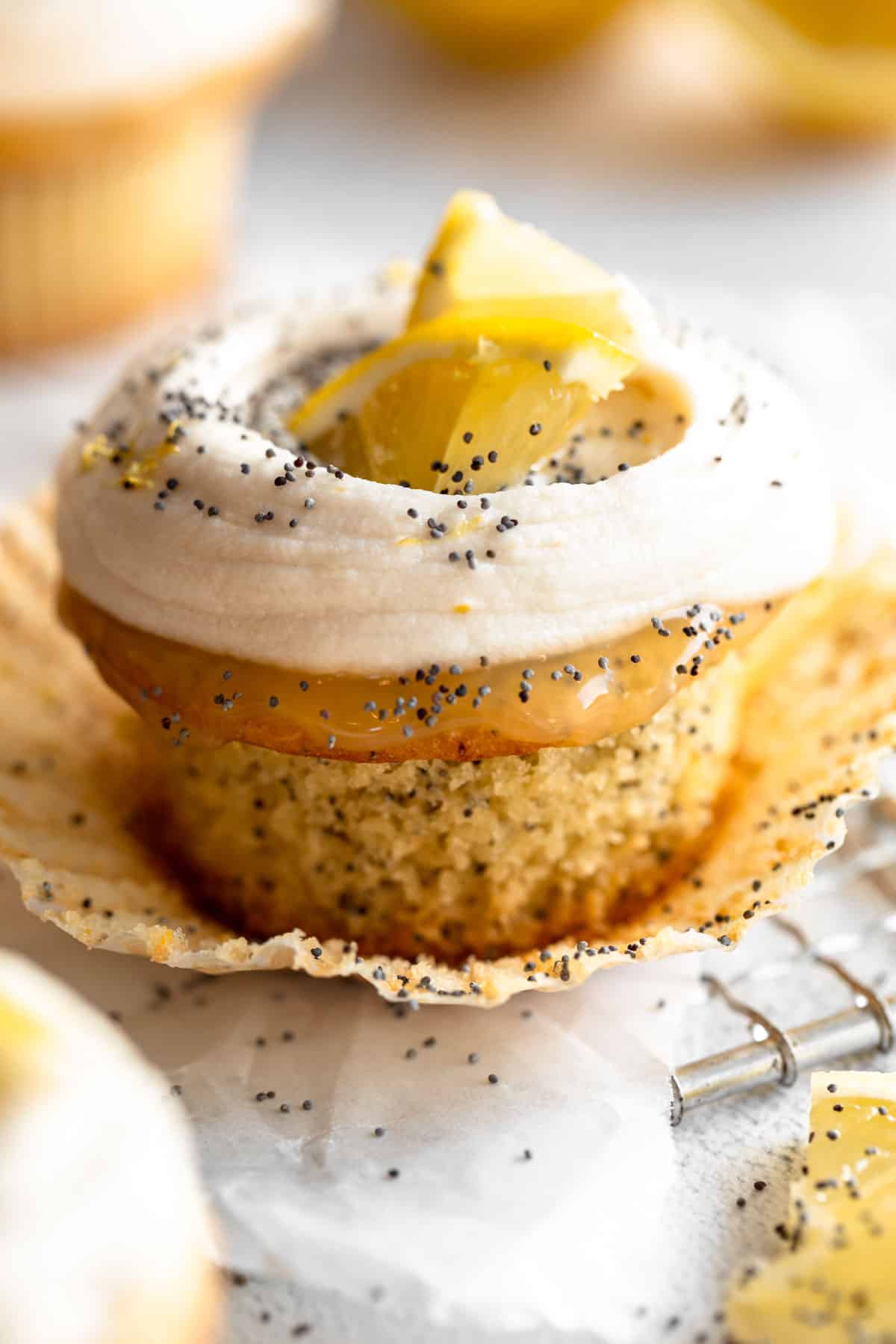 gluten free lemon poppy seed cupcakes with frosting on top