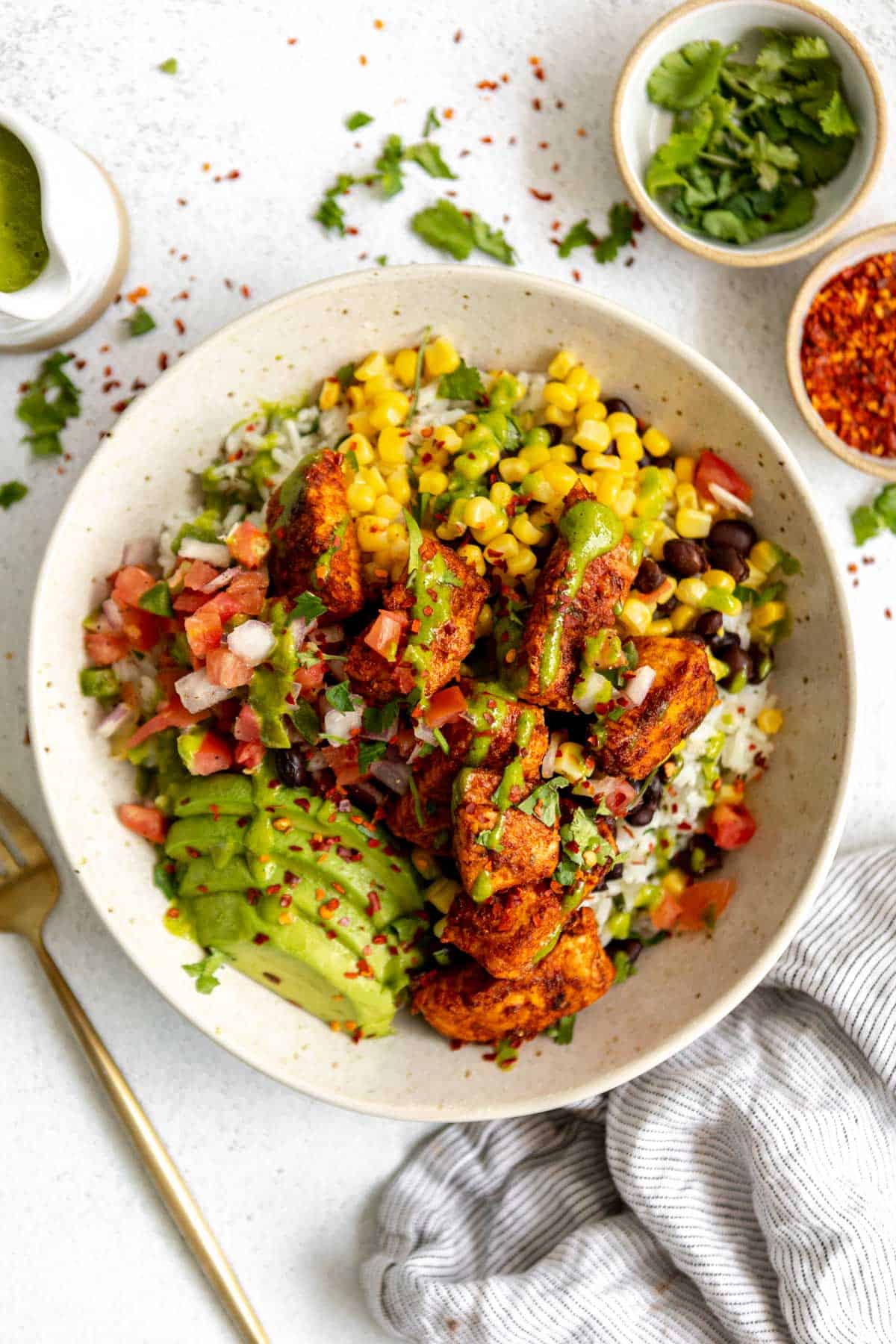 Salmon burrito bowls with rice, corn and beans