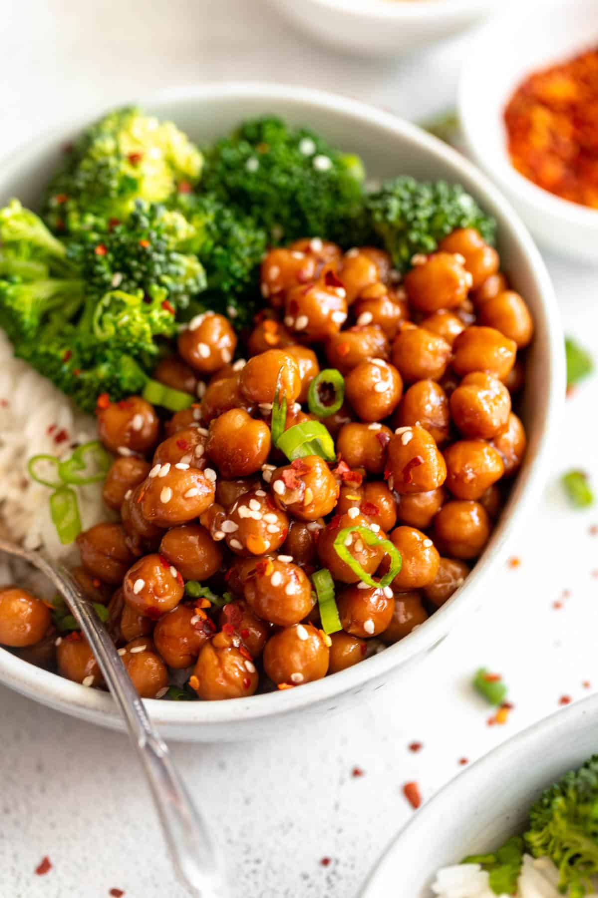 vegan sesame chickpeas in a bowl with rice and veggies