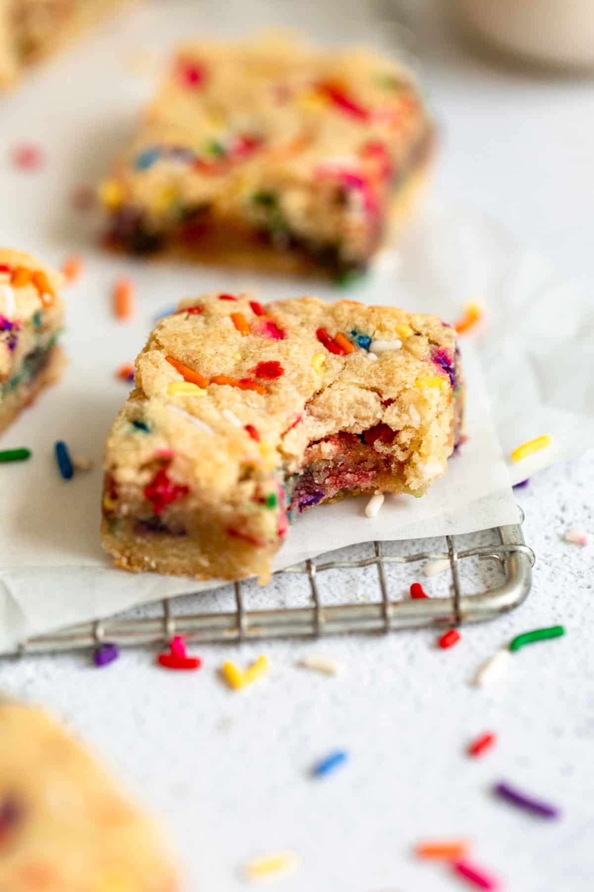vegan blondies with sprinkles for funfetti on parchment paper