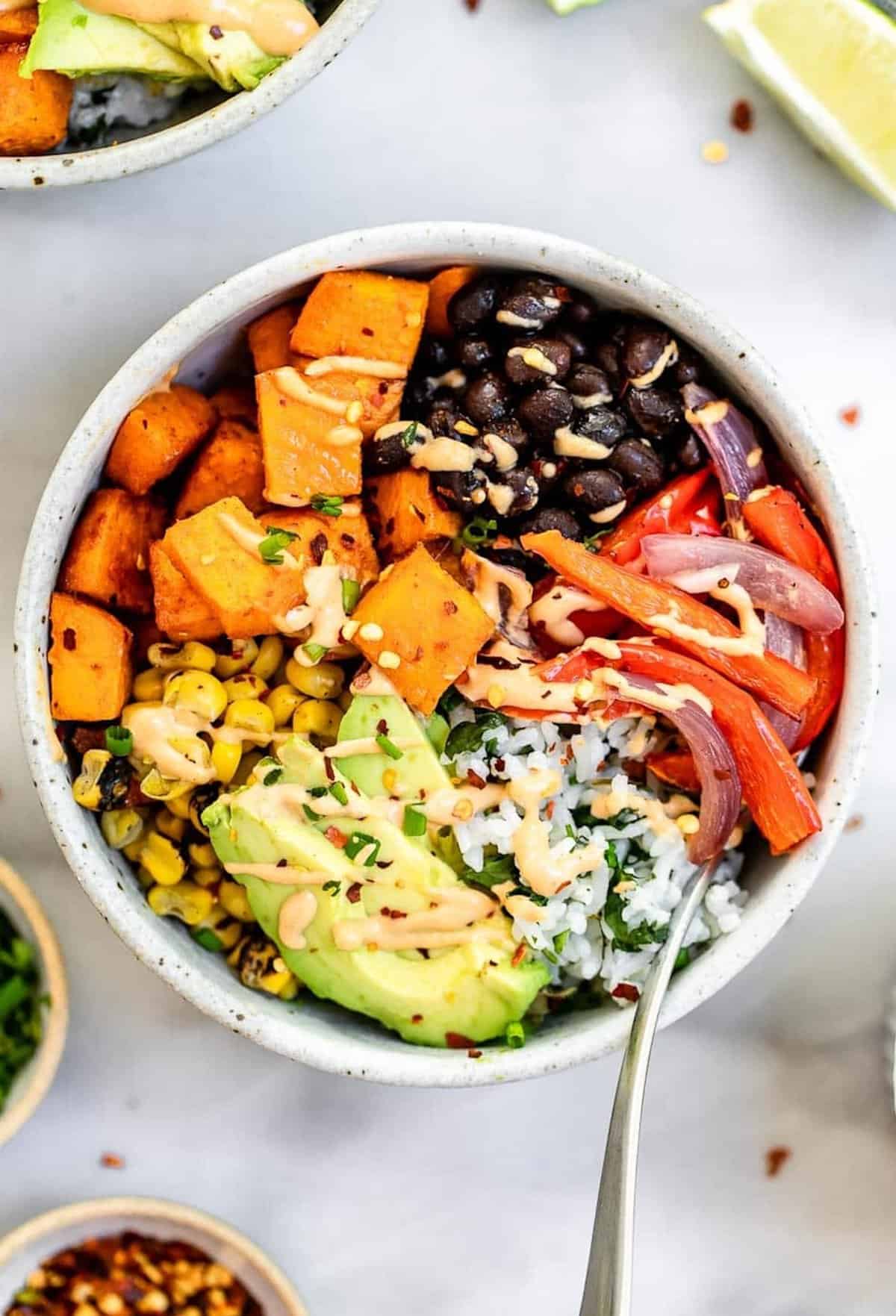 vegan sweet potato burrito bowl with black beans