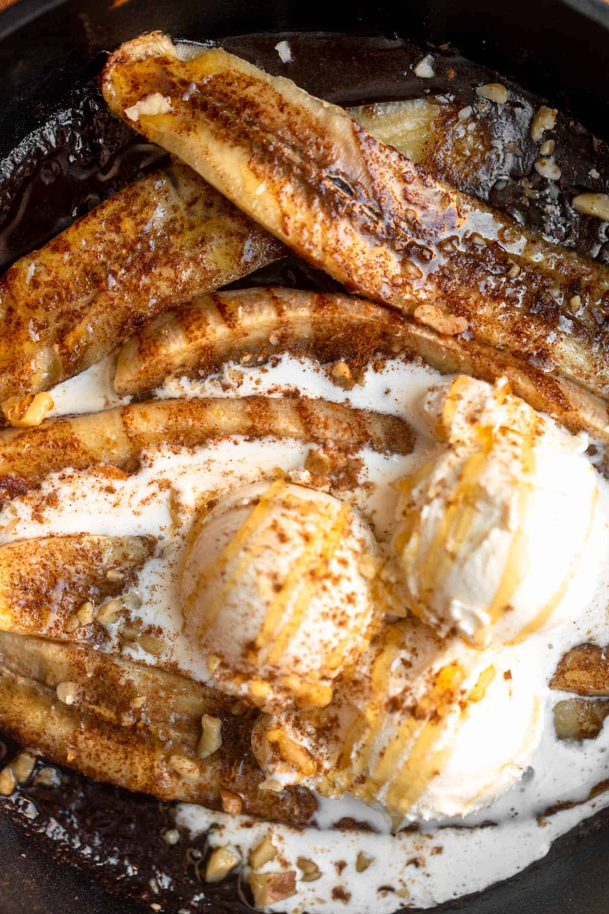 overhead shot of the baked bananas with ice cream and honey