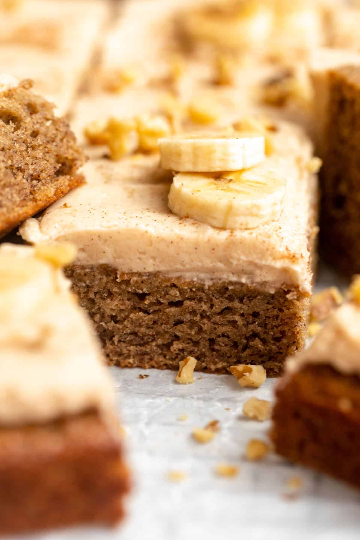 gluten free banana bread bars with maple frosting on top