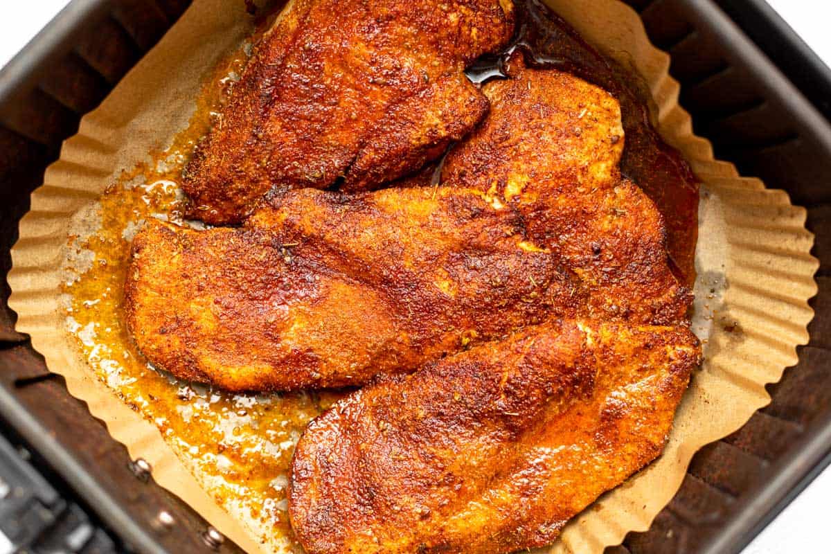 cooked chicken in an air fryer after cooking