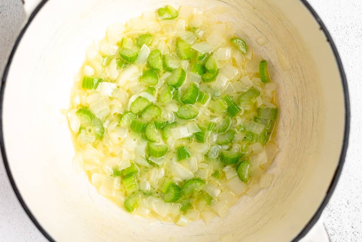 sauteeing the veggies in a pot