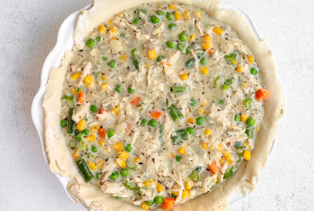 chicken pot pie in a pie dish before baking