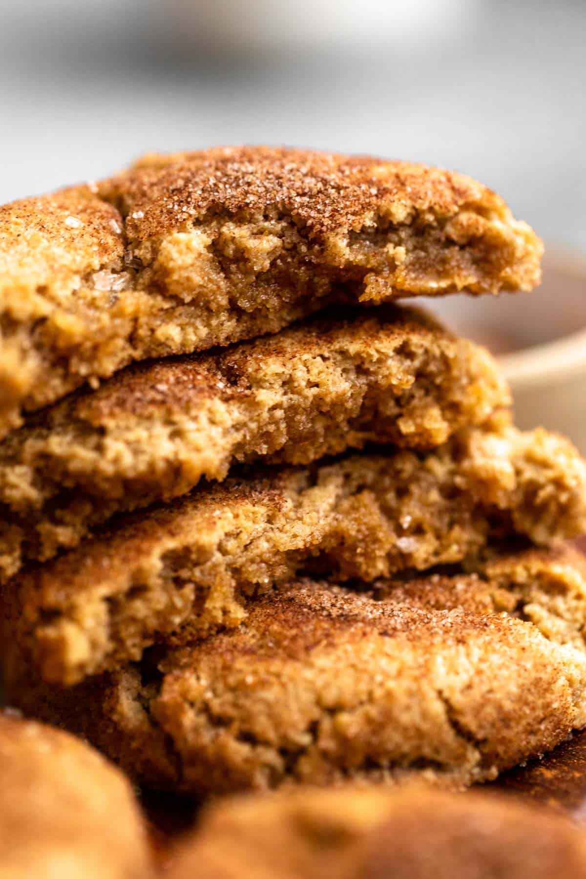 almond flour snickerdoodles ripped in half to show inside texture