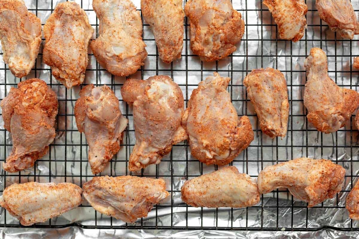 meat on a wire rack before baking