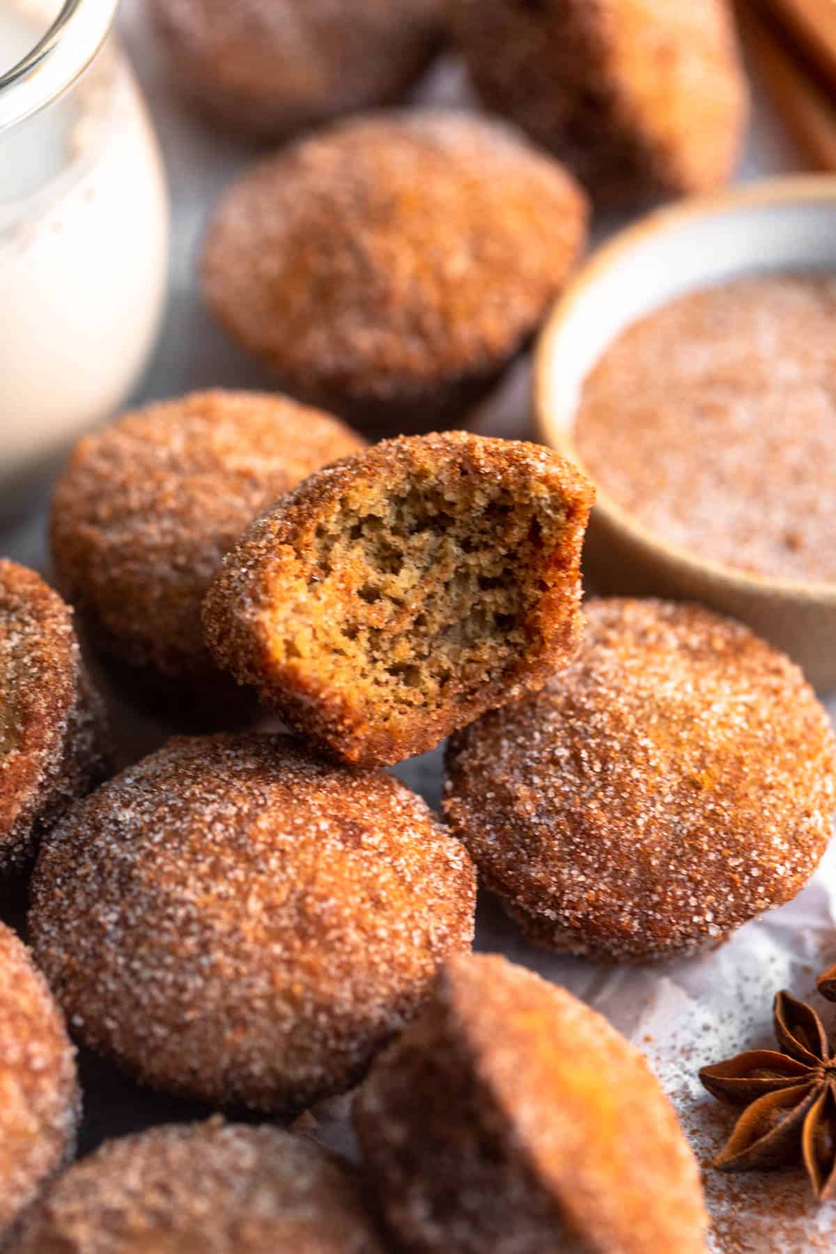 mini banana muffins with cinnamon sugar and a bite taken out