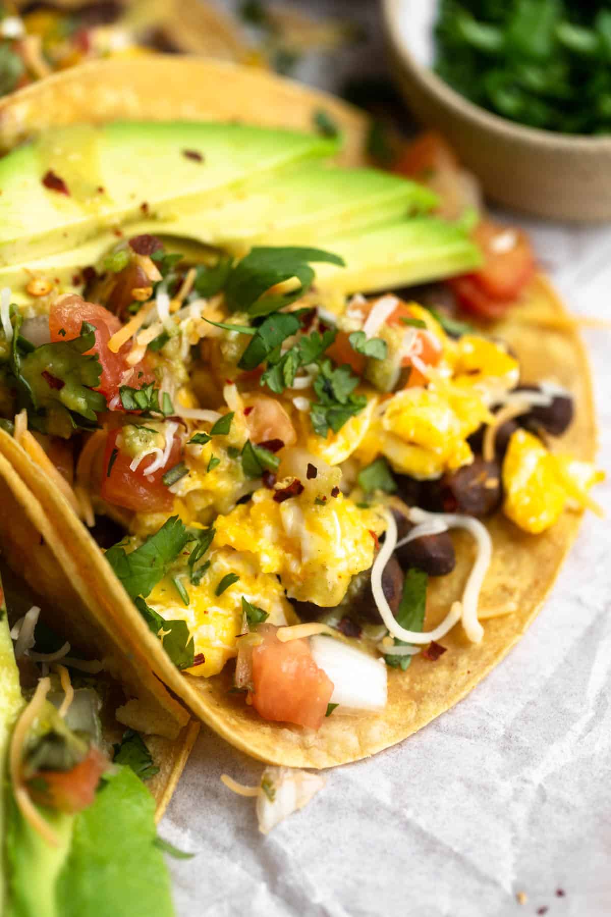 angled view of the gluten free black bean breakfast tacos with cheese