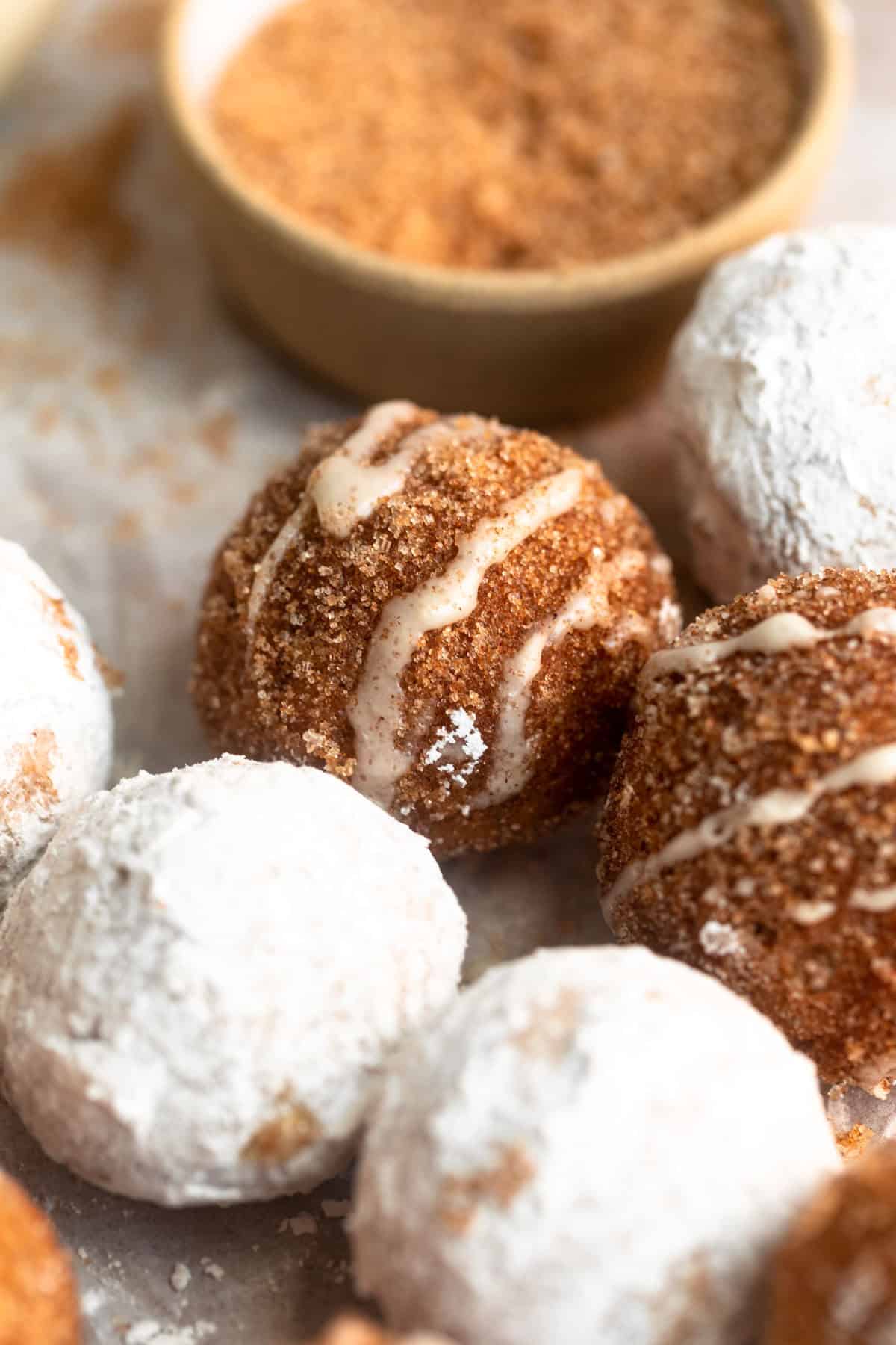 gluten free donut holes with cinnamon sugar and powdered sugar