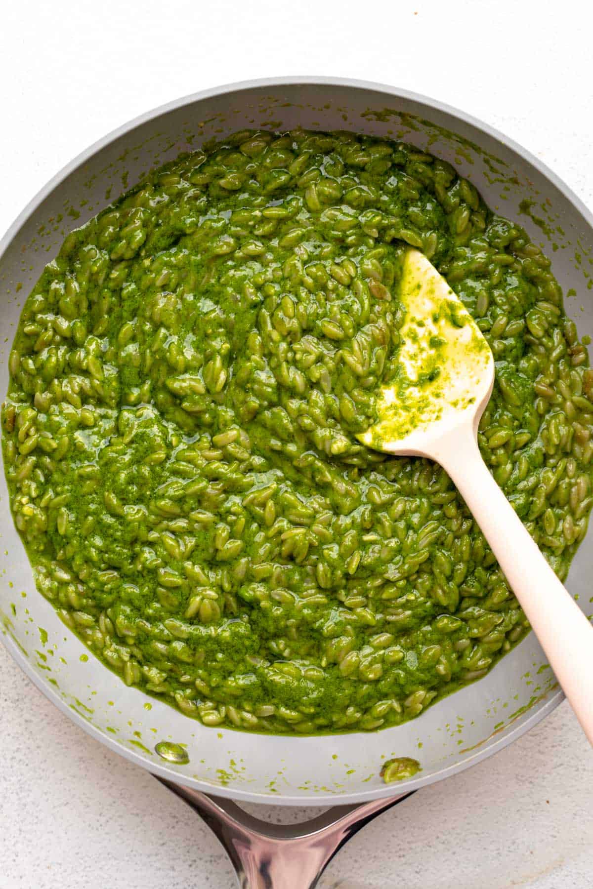 orzo in a pot after combining with the sauce