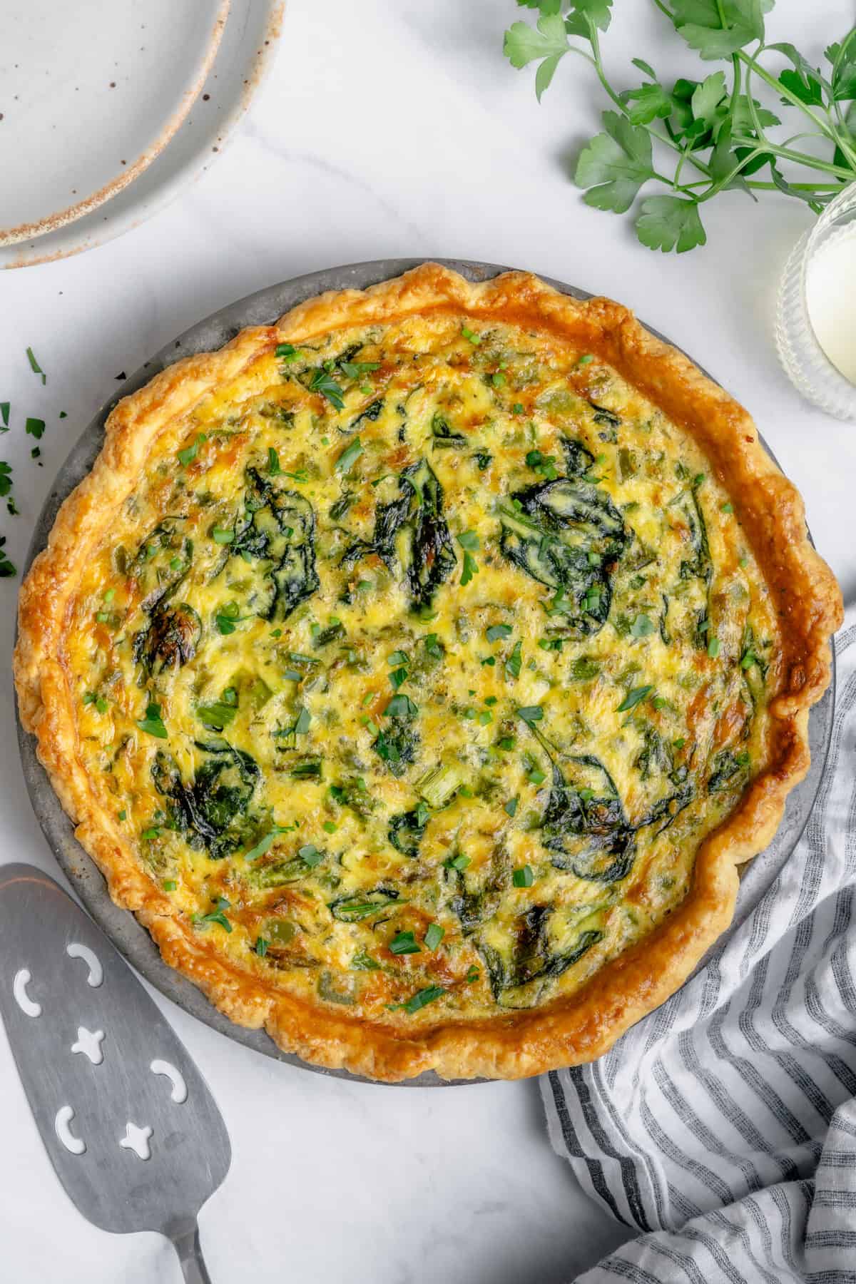 gluten free quiche in a pie pan with veggies