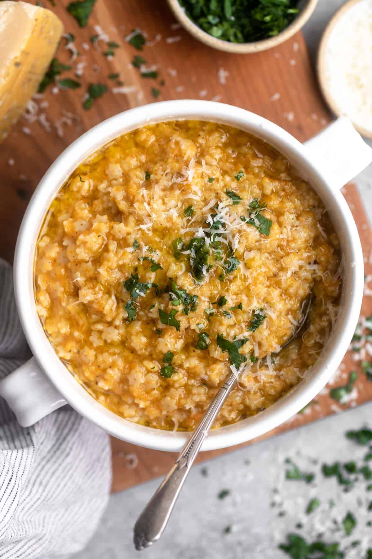 gluten free pastina in a bowl with parmesan