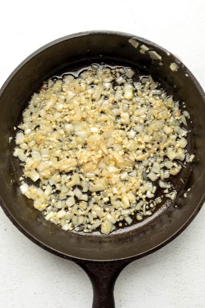 shallot and garlic sauteeing in a pan