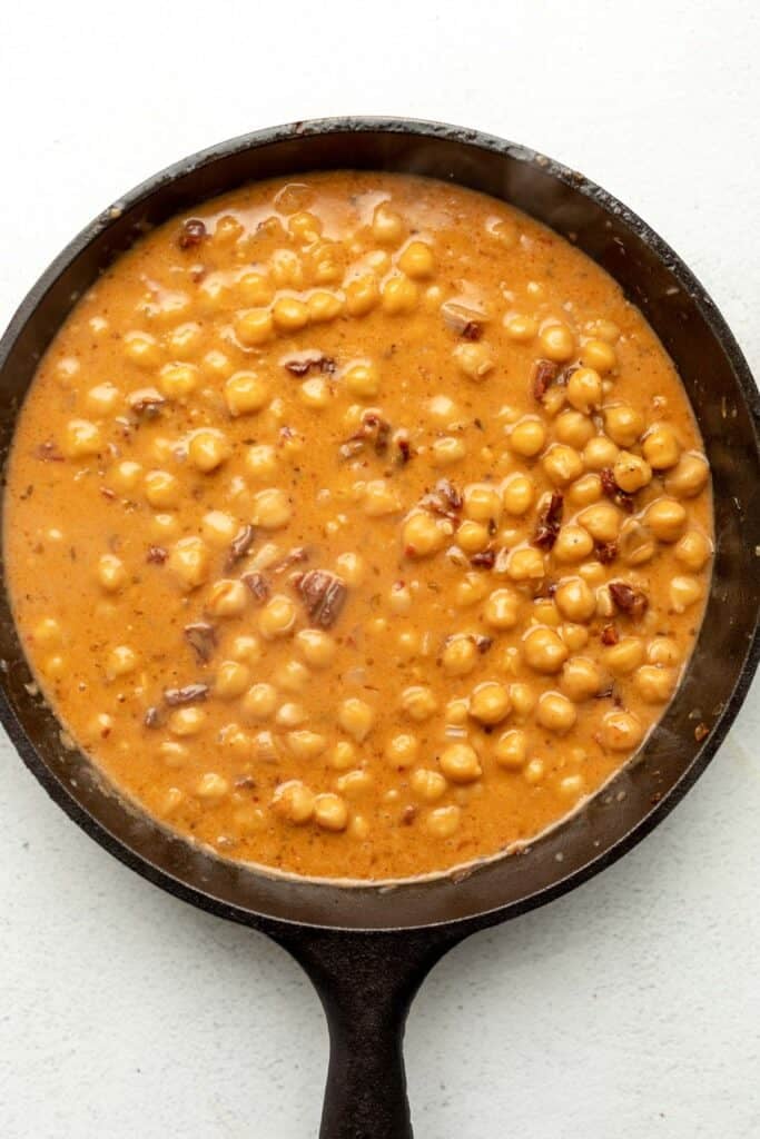 chickpeas simmering in a skillet
