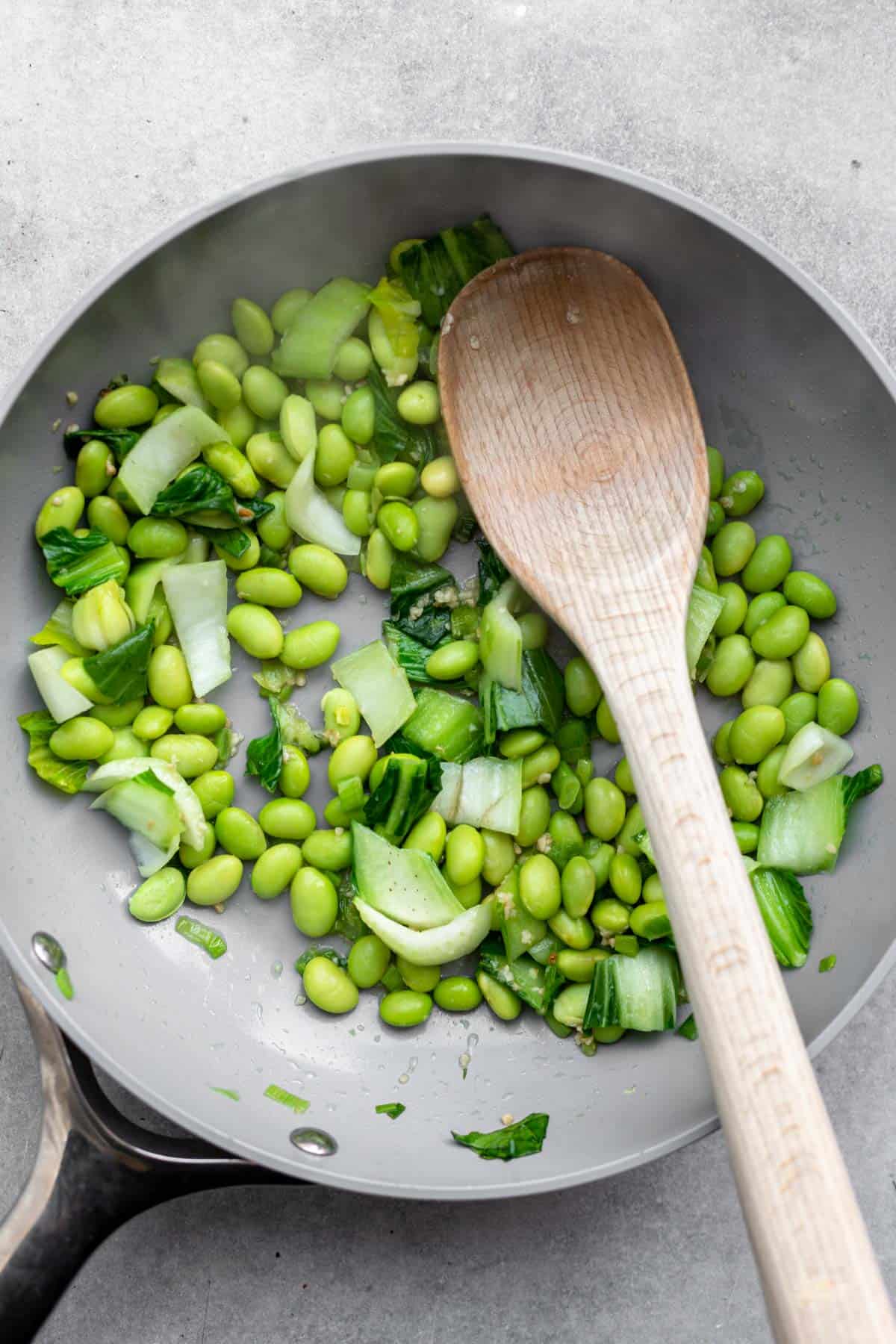 sauteeing the veggies in a pan