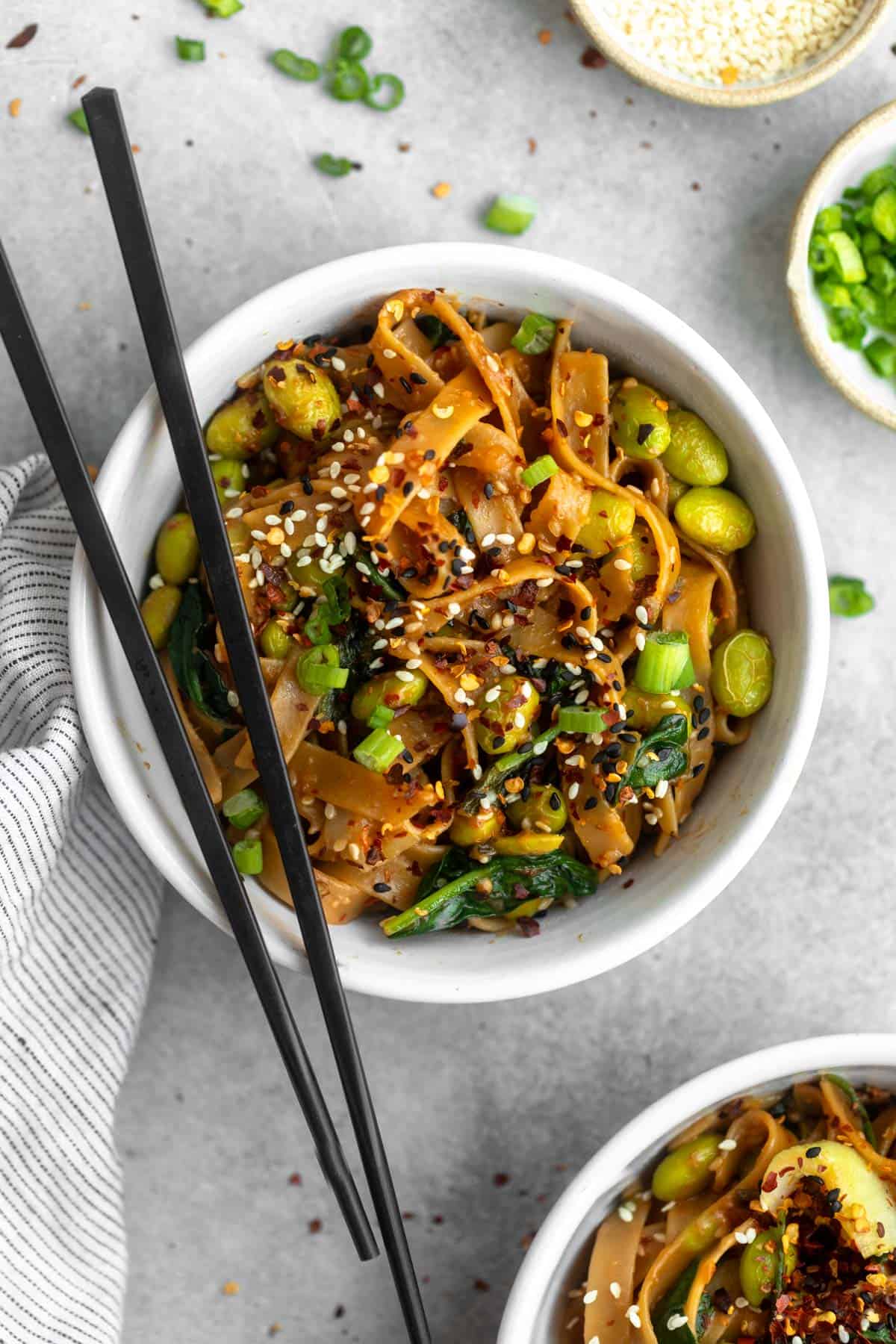 sesame miso noodles in a bowl with chopsticks