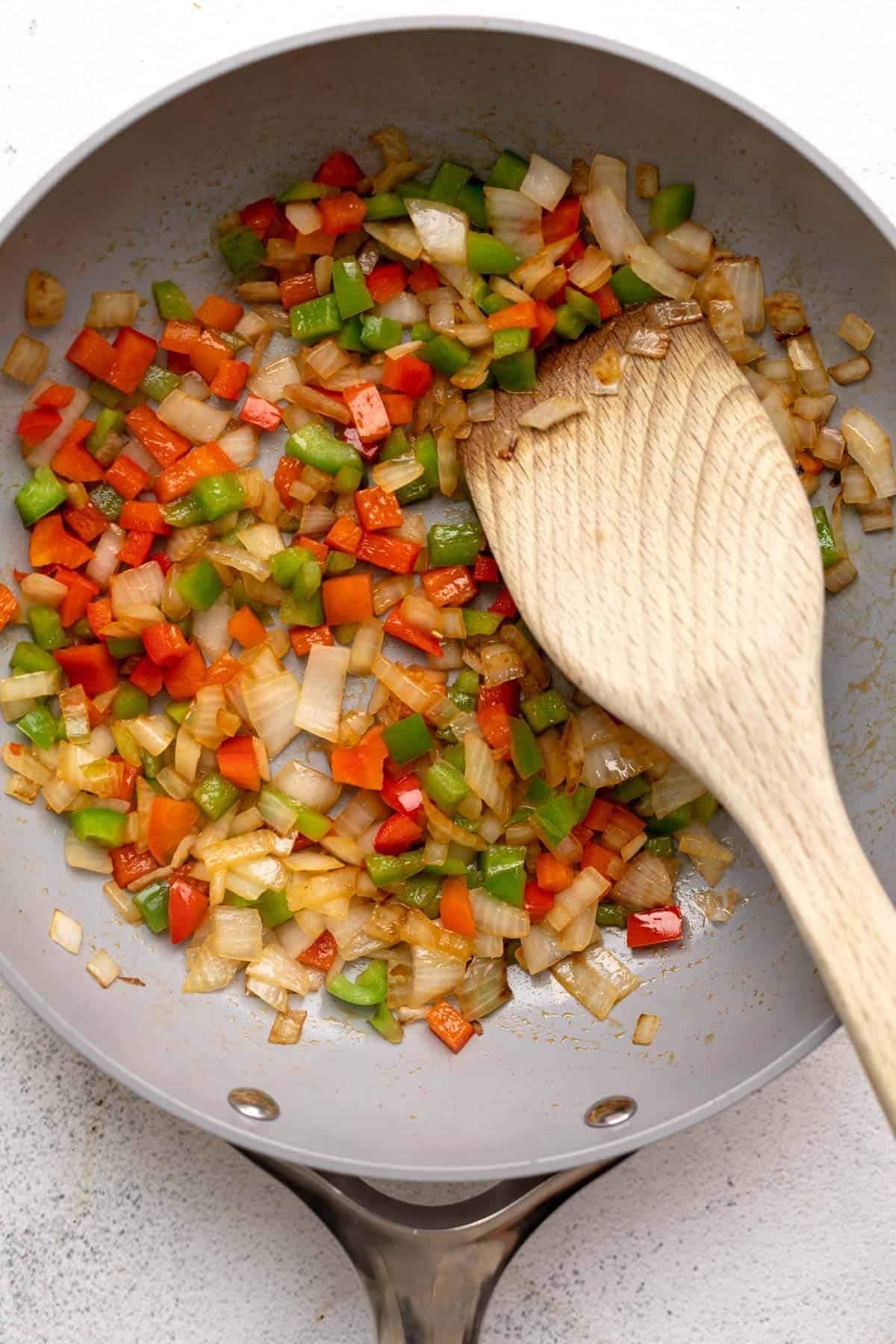 sauteeing the bell pepper in a pan