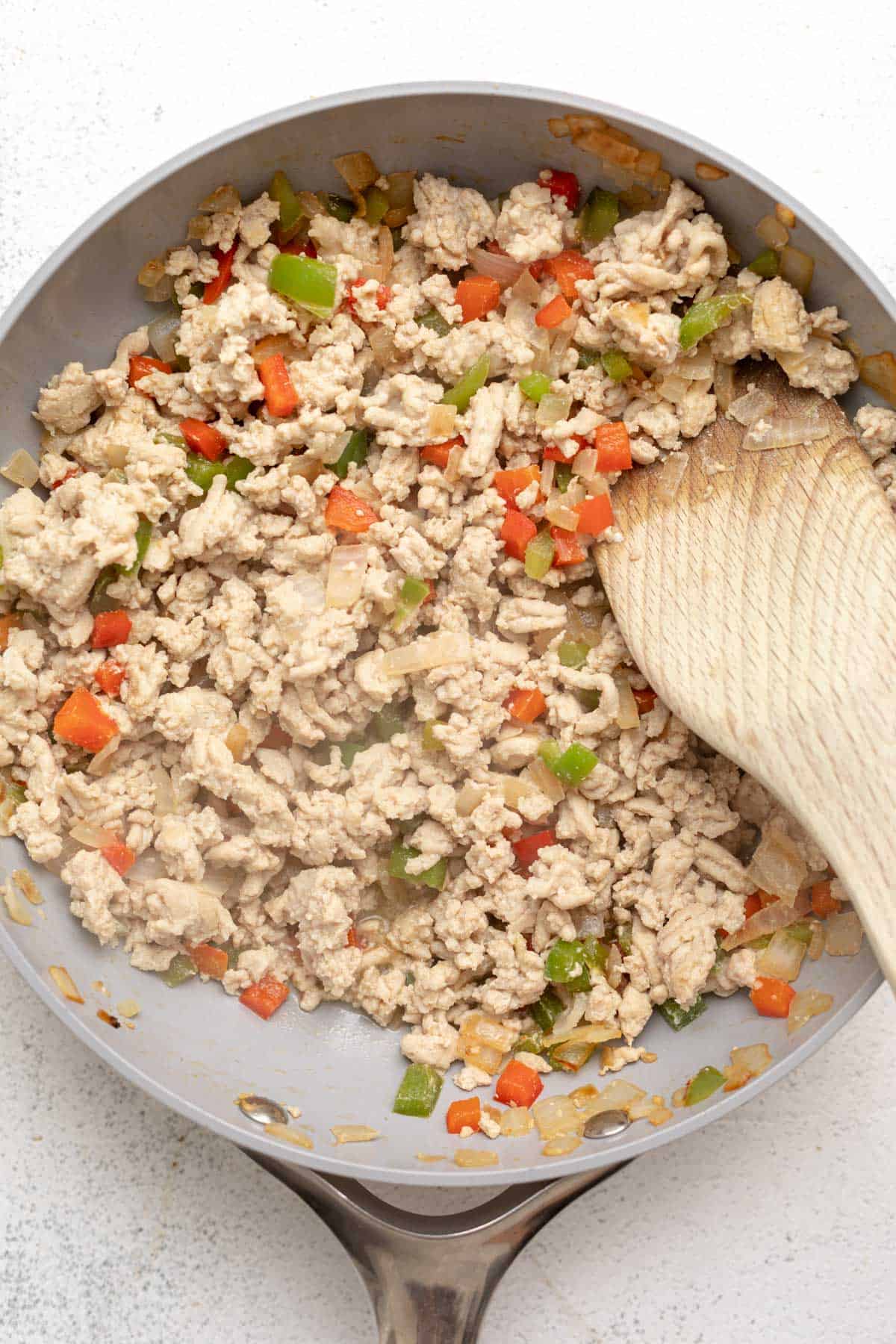 cooking the meat with veggies