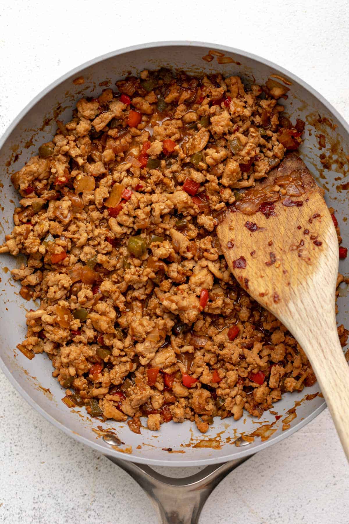 chicken in a pan after adding the sauce