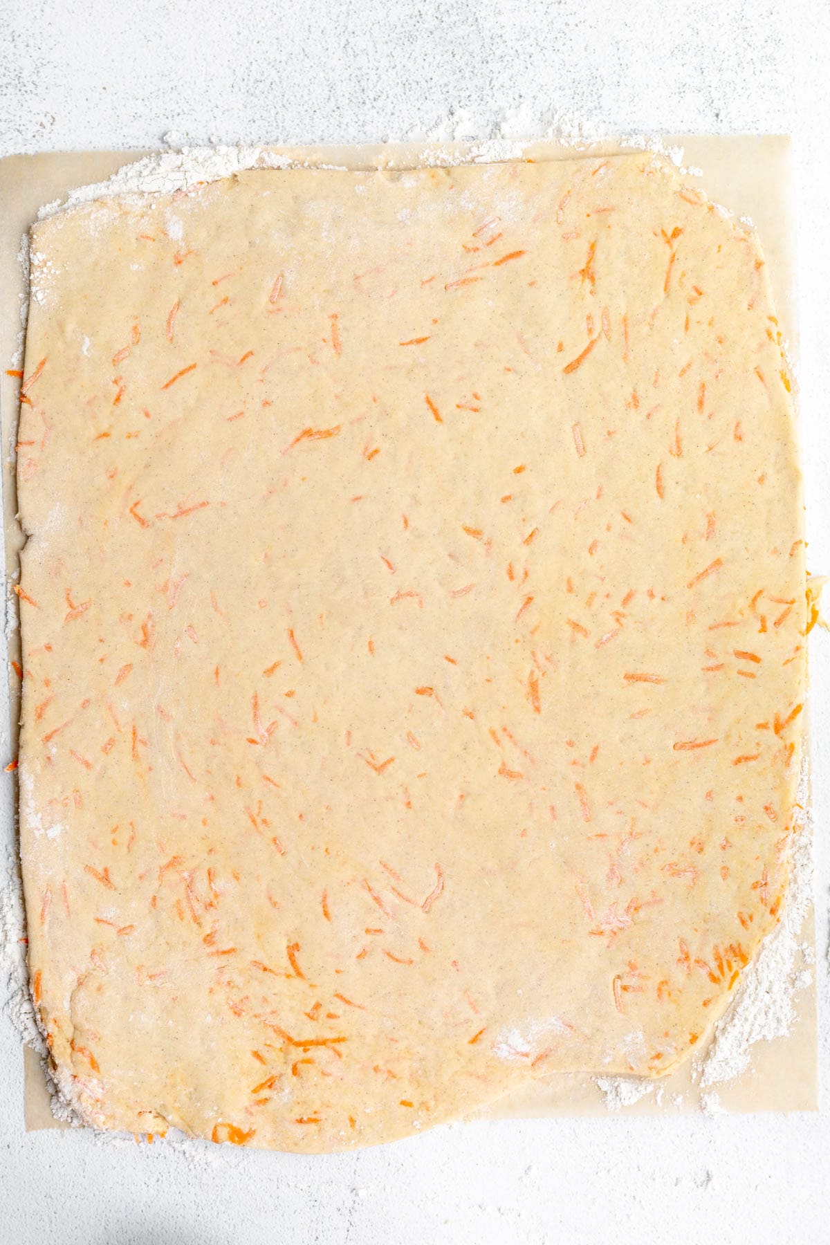 rolled out dough on a piece of parchment paper