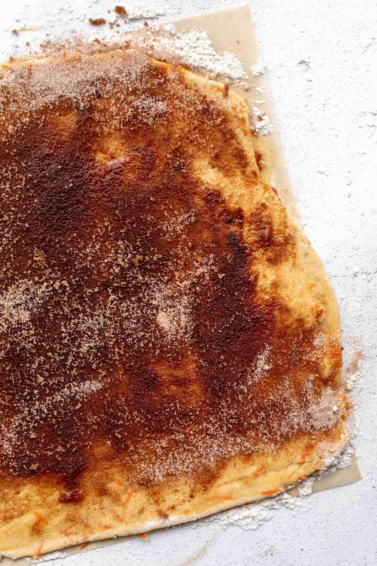 dough with the spiced sugar on parchment paper