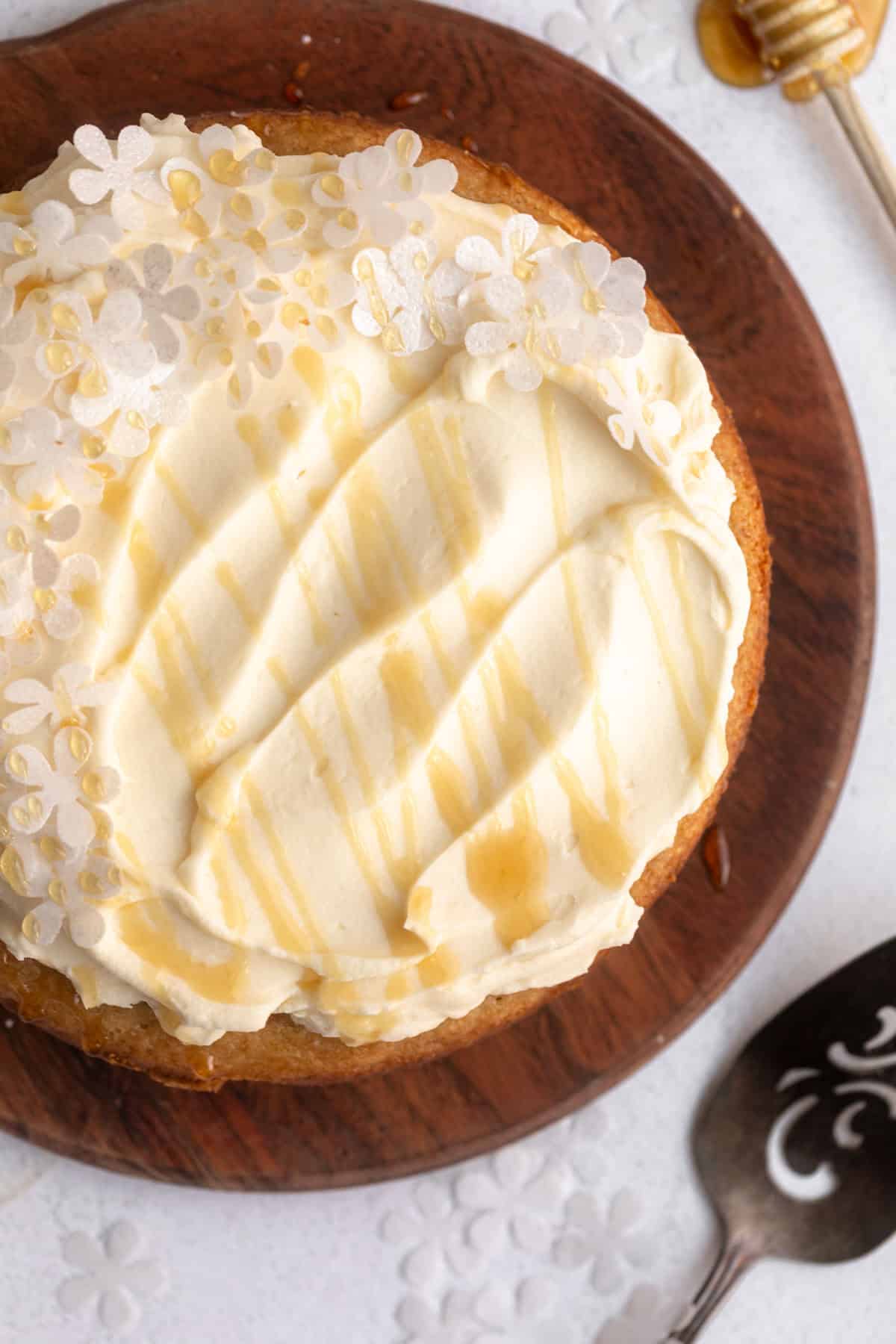 gluten free honey cake with whipped frosting on top