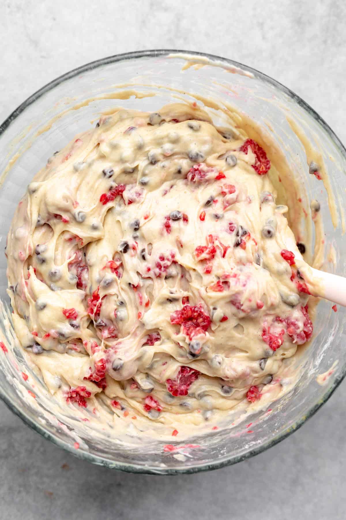 batter in a bowl with a spoon on the side