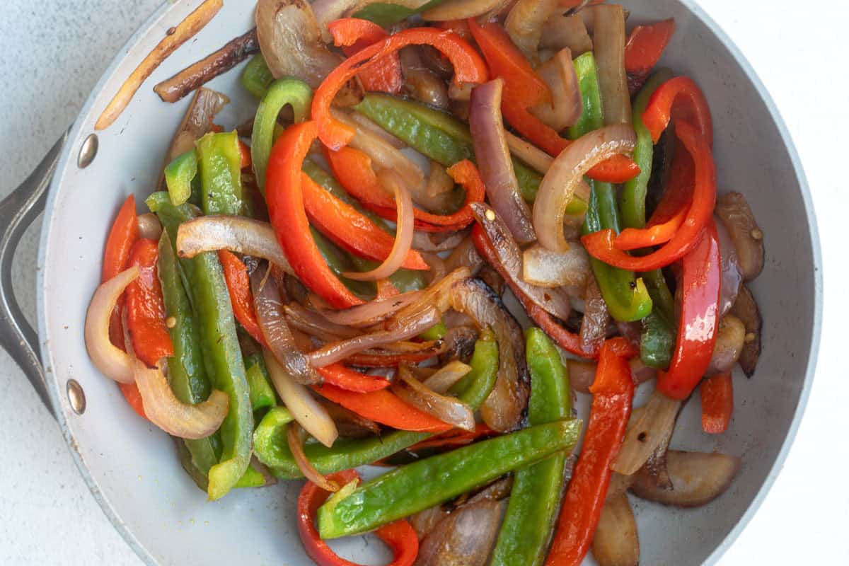 veggies sauteeing in a pan