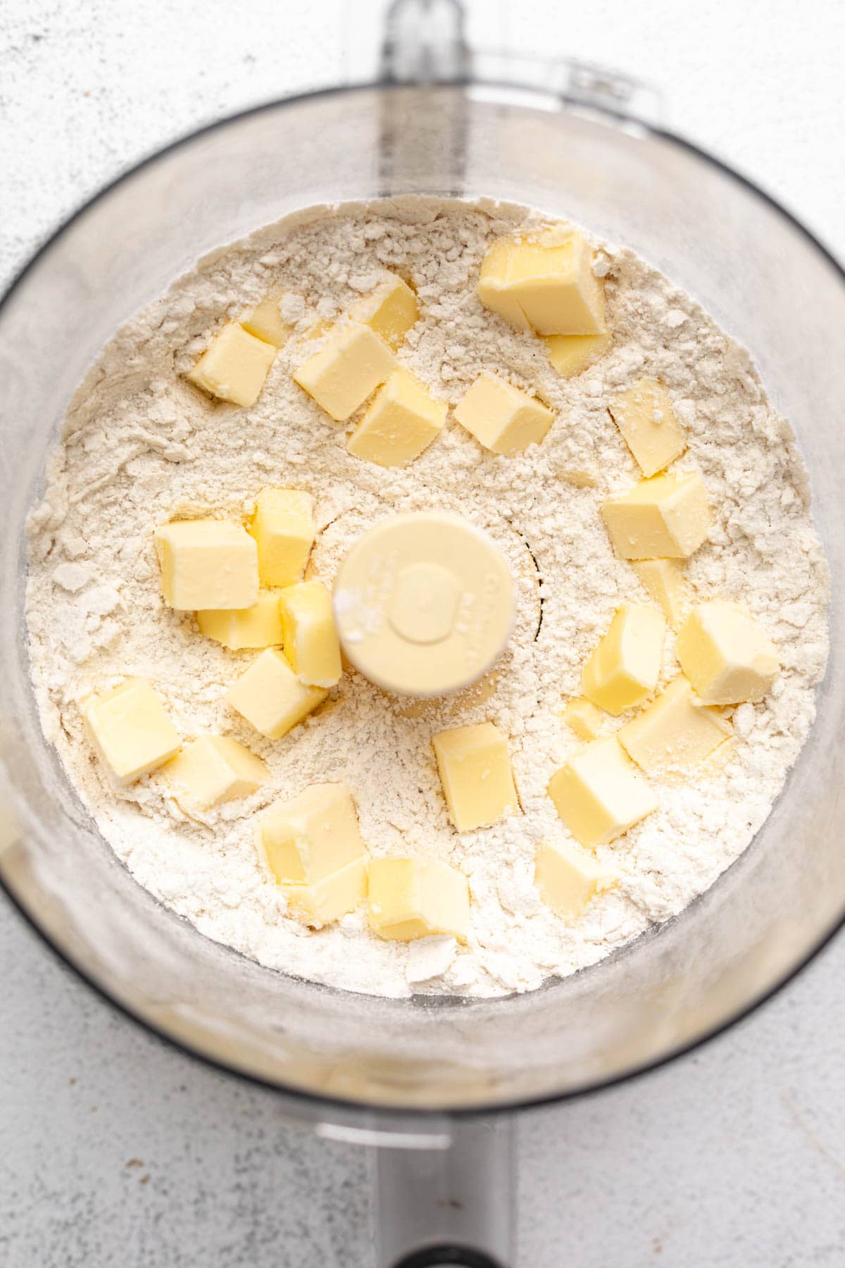 dry ingredients in a food processor with butter